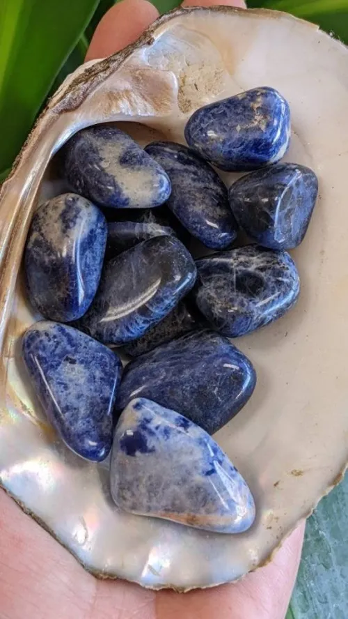 Sodalite under ultraviolet light showing orange fluorescence