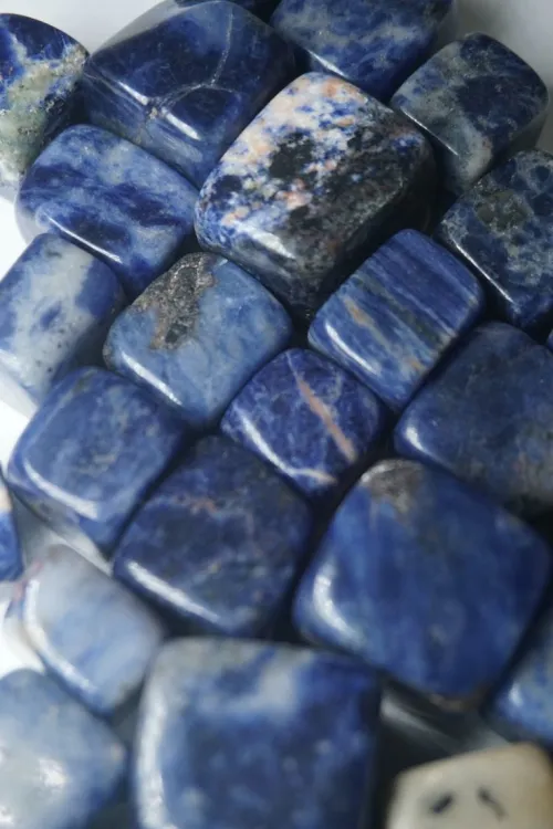 Sodalite under varied lighting showing luster differences